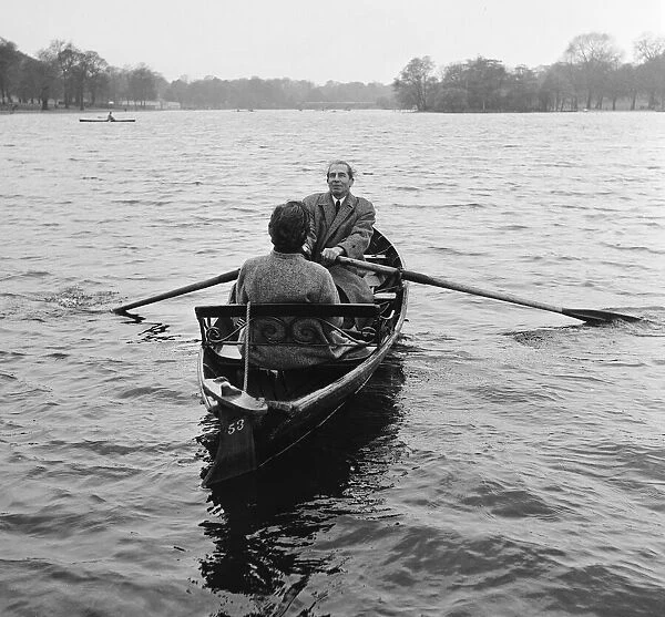 Mr Willis, an author, and his wife rowing on the Serpentine in Londons Hyde Park