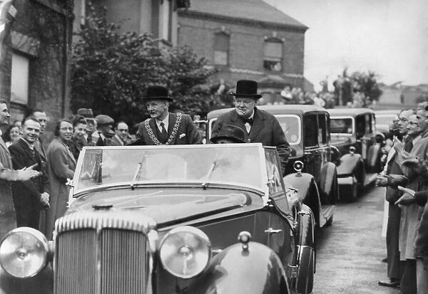 Mr. Winston Churchill is travelling in a car with the mayor of Coventry, Mr. J. A