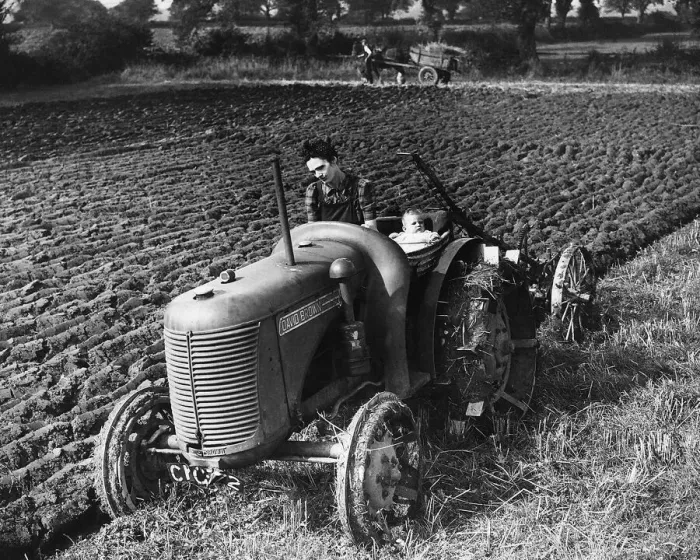 Framed Print : MRP Wyatt runs a tractor on a Glamorgan farm near Cardiff Her six month old child Betty