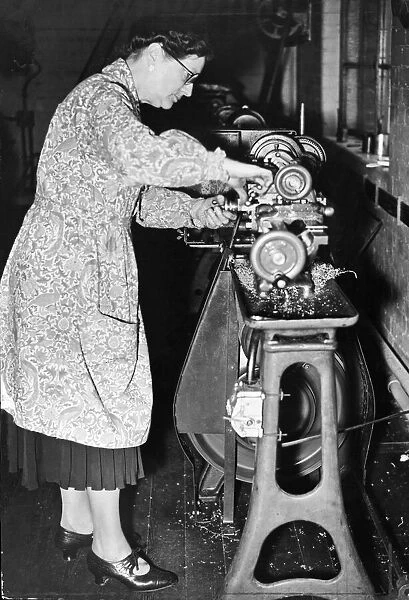 Mrs A. C. Driver aged 50 at work at her lathe at the Beaufoy Technical Institute in