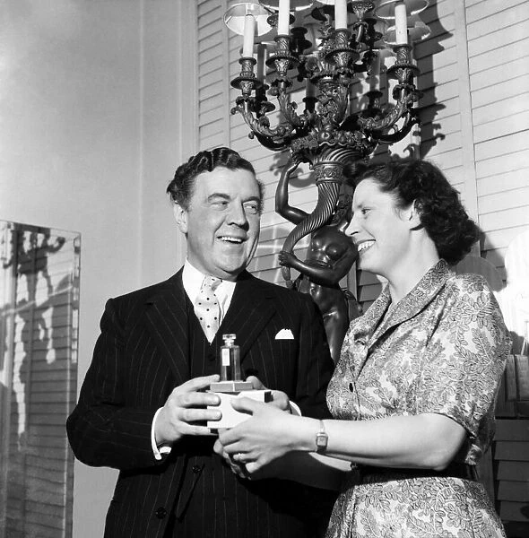 Mrs. Campbell with Normen Harthell designer. March 1953 D1341-001
