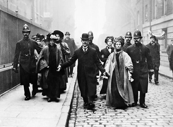 Mrs Emmeline Pankhurst Under Arrest. 21st May 1908. being escorted by Policemen