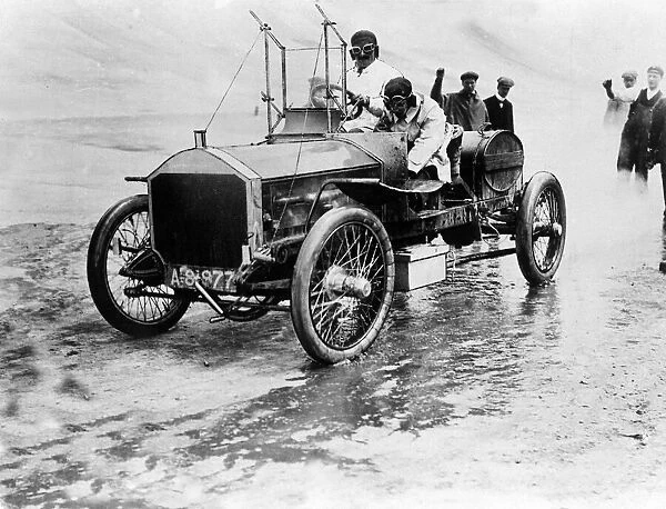 Mrs F Edge seen here stopping for petrol and to change wheels during motor trials circa