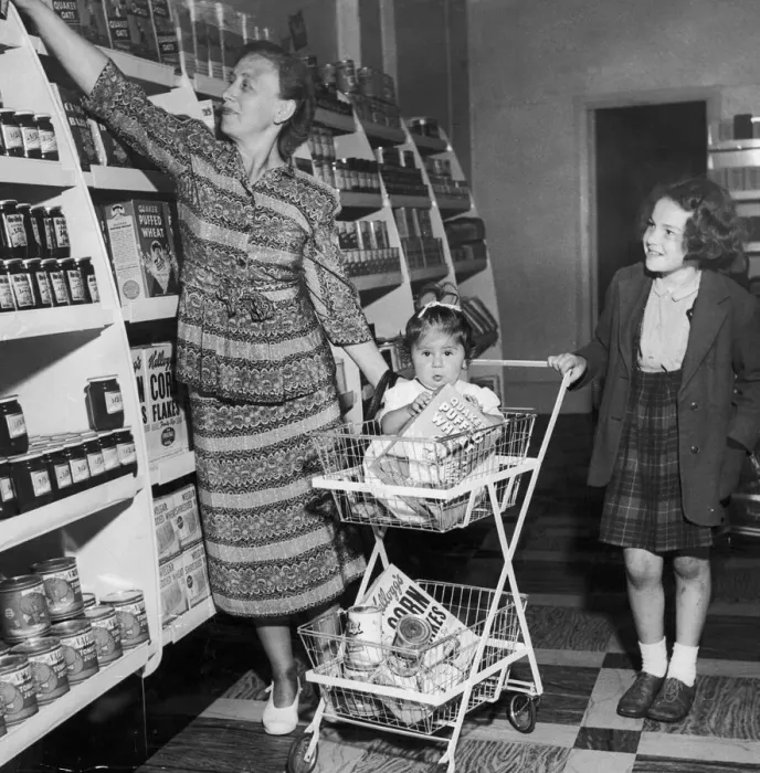 Framed Print : Mrs Freda Fox seen here selecting a jar of jam from the shelves of the new self service Framed Print : Mrs Freda Fox seen here selecting a jar of jam from the shelves of the new self service