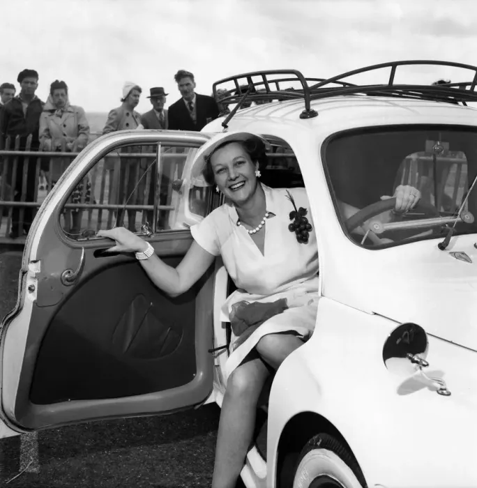 Framed Print : Mrs. Gordan Offord poses in a car during the Brighton beauty contest Framed Print : Mrs. Gordan Offord poses in a car during the Brighton beauty contest