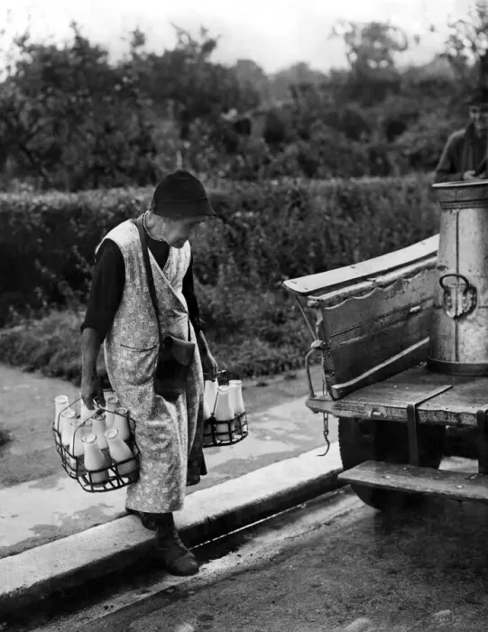 Framed Print : Mrs. Harriet Spencer aged 86, loading her milk float ready for the morning round which Framed Print : Mrs. Harriet Spencer aged 86, loading her milk float ready for the morning round which