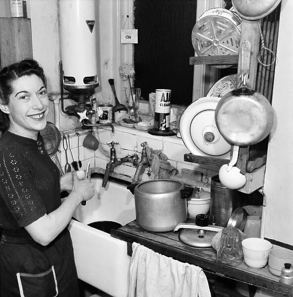 Mrs. J. S. Srow doing the housework. April 1953 D1669