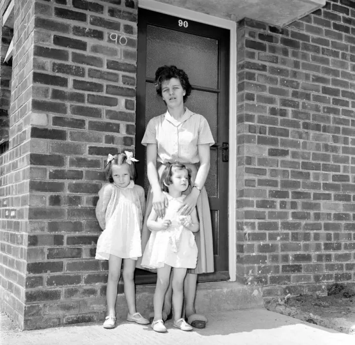 Framed Print : Mrs. Kirby and her daughters, Carol, 5, and Sandra, 4, outside their council house today Framed Print : Mrs. Kirby and her daughters, Carol, 5, and Sandra, 4, outside their council house today