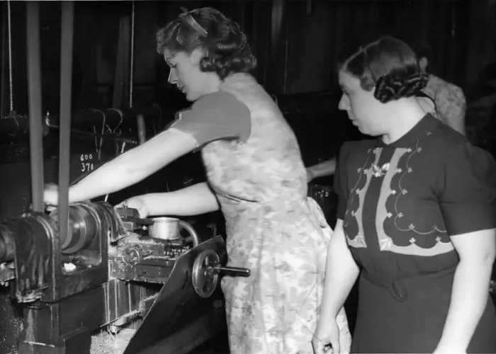 Framed Print : Mrs Knight gets down to some tank parts under the eye of forewoman Mrs Jeanings at a Framed Print : Mrs Knight gets down to some tank parts under the eye of forewoman Mrs Jeanings at a