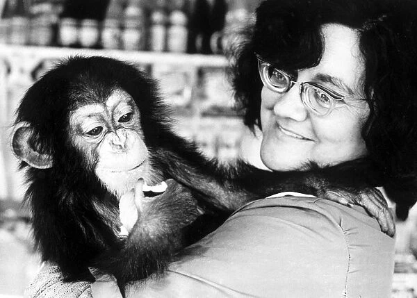 Mrs Leslie Clews with Judy the one year old chimpanzee, pictured at Southam Zoo farm