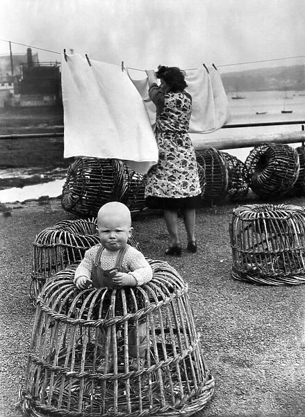 Mrs Lorna Barnicoat of North Quay House, Falmouth, Cornwall hangs out her washing in