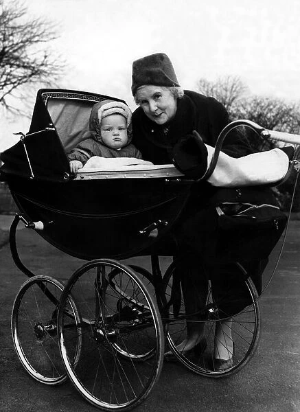 Mrs M Milburn with her grandson Francis John Woodley in his high pram on 23rd March 1961