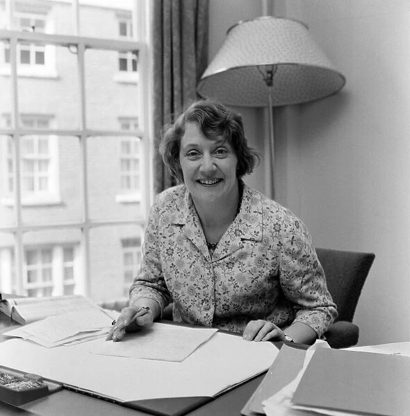 Mrs. Shirley Williams at her desk at the Ministry of Labour at St. James Square