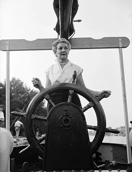 Mrs Tepper on her boat Cornelia at Kingston Bridge, London. 31st August 1955