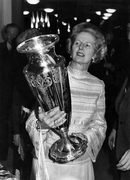 Mrs. Thatcher inspects the Wightman Cup, won earlier this year by Britain