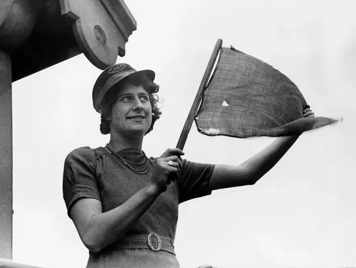 Framed Print : Mrs Village an LNER railway worker signals to a train during WW2. 1941 Framed Print : Mrs Village an LNER railway worker signals to a train during WW2. 1941