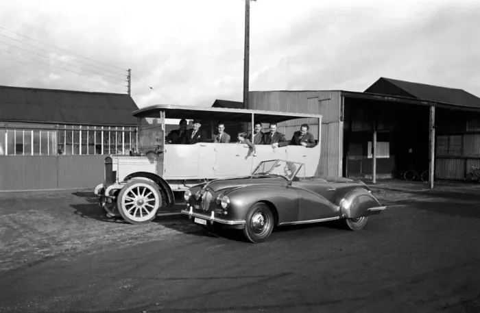 Framed Print : Mrs. W. A. Hudson seen here passing a vintage coach in her new sports car Framed Print : Mrs. W. A. Hudson seen here passing a vintage coach in her new sports car