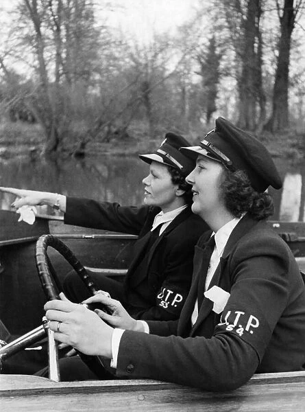 Mrs. W C Thiele (right) and Mrs. P Bartlett who are the helmsmen of patrol launches of
