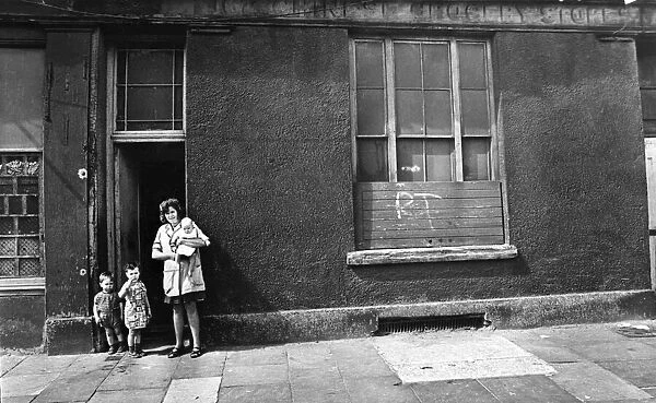 Mrs Yvonne Evans of Bute Street, Cardiff, with her children, Janet, aged 3, Stephen