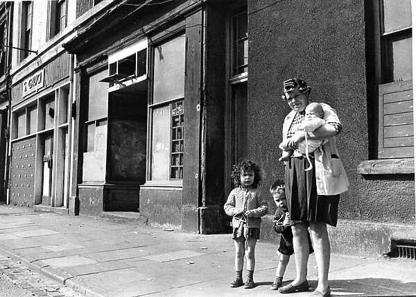 Mrs Yvonne Evans with her three children in Bute Street, Cardiff June 1969