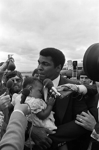 Muhammad Ali arrives at Teesside Airport with his family. July 1977