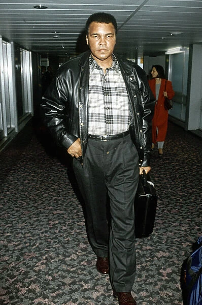 Muhammad Ali arriving at Heathrow Airport. 1st December 1993