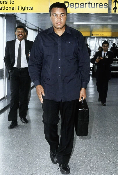 Muhammad Ali arriving at Heathrow Airport. 16th October 1989