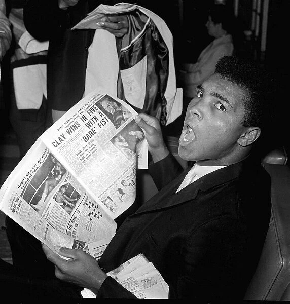 Muhammad Ali - Cassius Clay reading the Daily Mirror