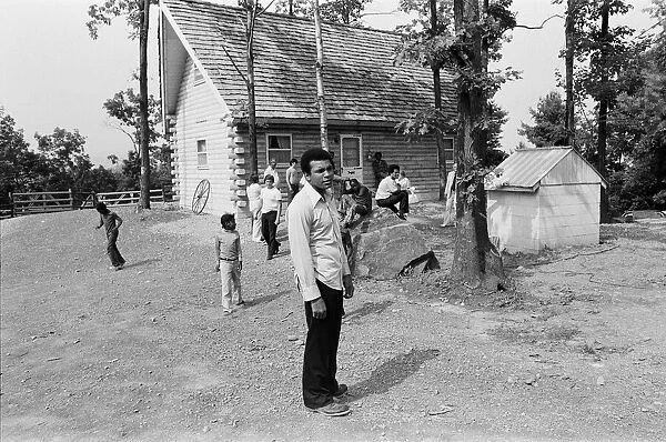 Muhammad Ali with fans at his training camp in Pennsylvania. 27th August 1974