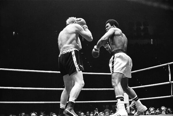 Muhammad Ali lands a punch as Richard Dunn tries to cover up in Munich
