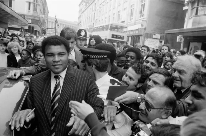 Framed Print : Muhammad Ali is mobbed by fans and supporters in the streets of Birmingham Framed Print : Muhammad Ali is mobbed by fans and supporters in the streets of Birmingham