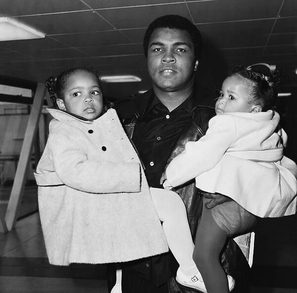 Muhammad Ali pictured here with his daughters at Heathrow Airport