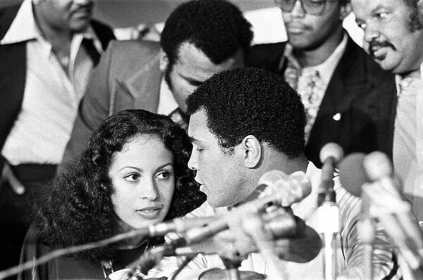 Muhammad Ali at the post match conference with wife Veronica. September 15, 1978