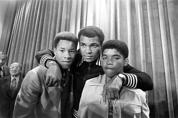 Muhammad Ali at a press conference with Phillip 'Chip'McAllister, left