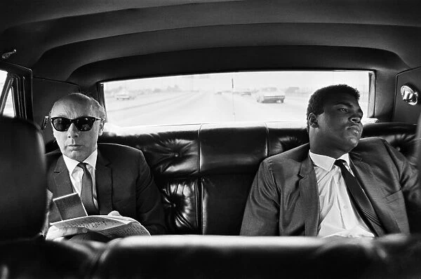 Muhammad Ali (right) with Daily Mirror reporter Donald Zec in the back of a car