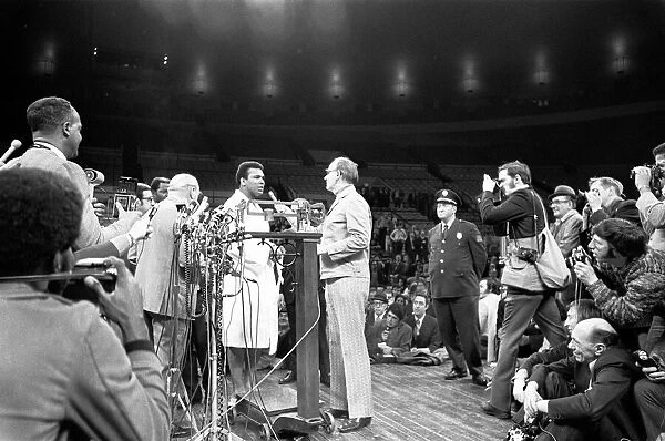 Muhammad Ali on the scales ahead of his first fight with Joe Frazier December 1972