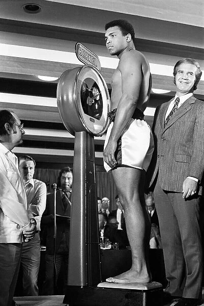 Muhammad Ali on the scales prior to his fight with Alvin Lewis, aka Blue Lewis