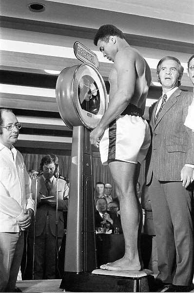 Muhammad Ali on the scales prior to his fight with Alvin Lewis, aka Blue Lewis