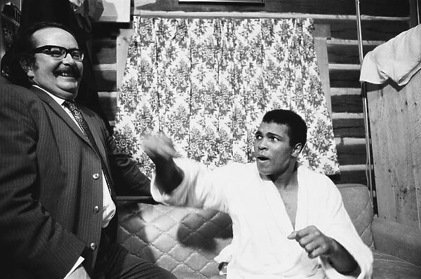 Muhammad Ali seen here with Daily Mirror boxing correspondent Frank McGhee at Ali