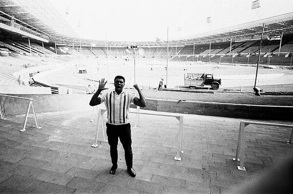 Muhammad Ali seen here at Wembley looking at the preparations for his defence of his