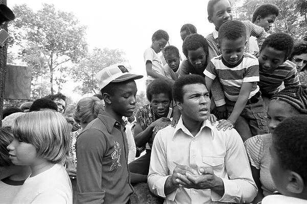 Muhammad Ali signing autographs for fans in Pennsylvania. 27th August 1974