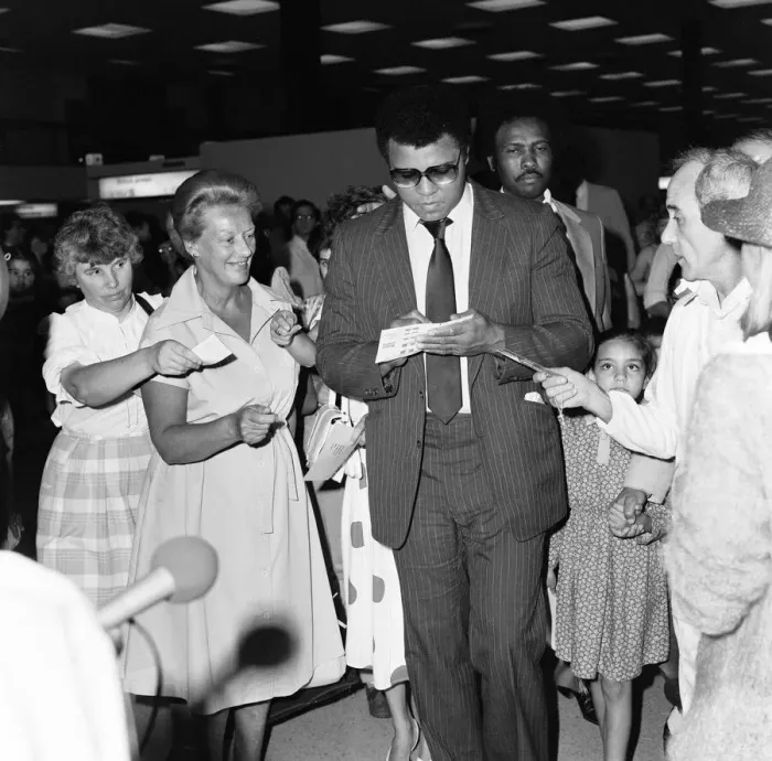 Framed Print : Muhammad Ali signing autographs for fans in England before his journey back to Chicago Framed Print : Muhammad Ali signing autographs for fans in England before his journey back to Chicago