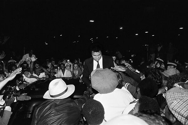 Muhammad Ali signing to enthusiastic fans in Handsworth Birmingham. 6th August 1983