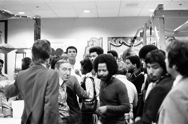 Muhammad Ali takes a break from training to talk to the press ahead of his rematch with