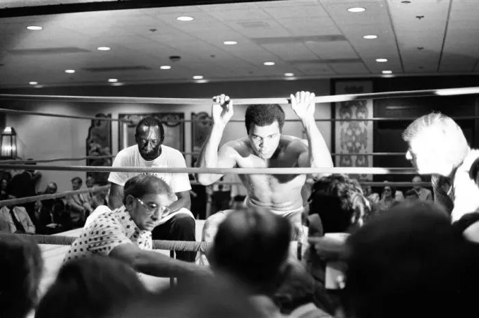 Framed Print : Muhammad Ali takes a break from training to talk to the press ahead of his rematch with