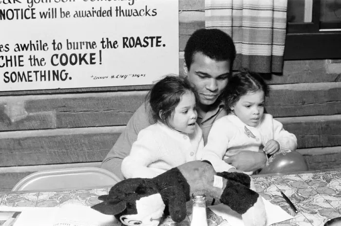 Framed Print : Muhammad Ali with twin daughters Jamillah and Rasheda in Deer Lake Pennsylvania Framed Print : Muhammad Ali with twin daughters Jamillah and Rasheda in Deer Lake Pennsylvania