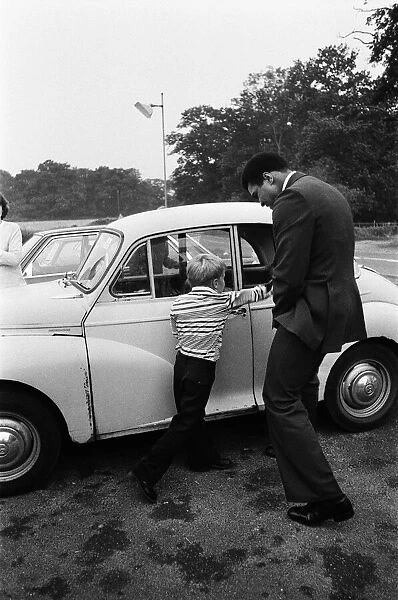 Muhammad Ali visiting Heckfield, Hampshire. Pictured, outside the New Inn pub