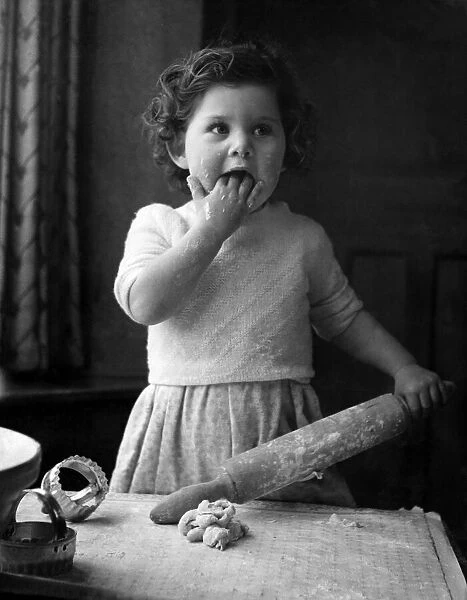 Mummy turned her back and baby realised her ambition. Mummy had made rolling pastry look