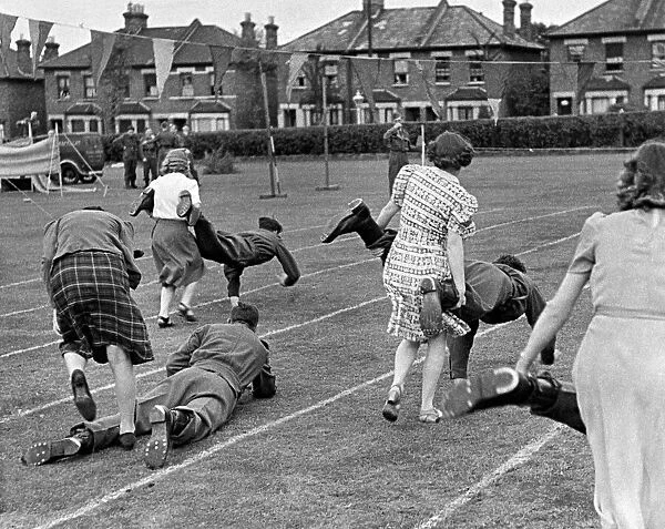 Munition workers taking part in the Wheelbarrow race during their sports day