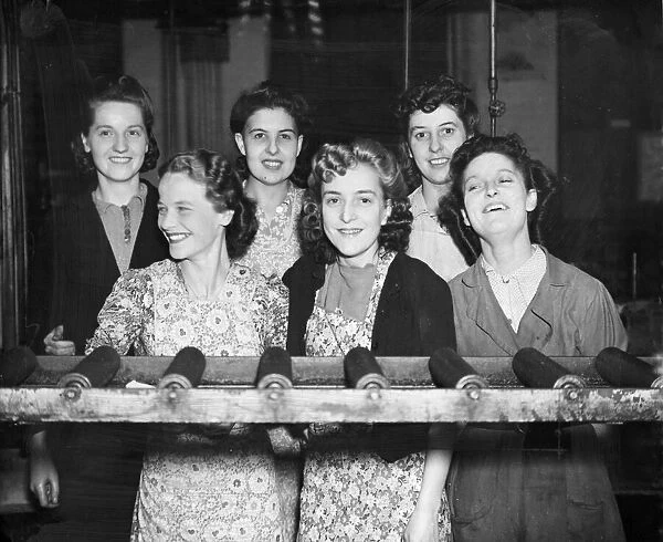 Munition working ladies in their factory. They are enjoying their moment together